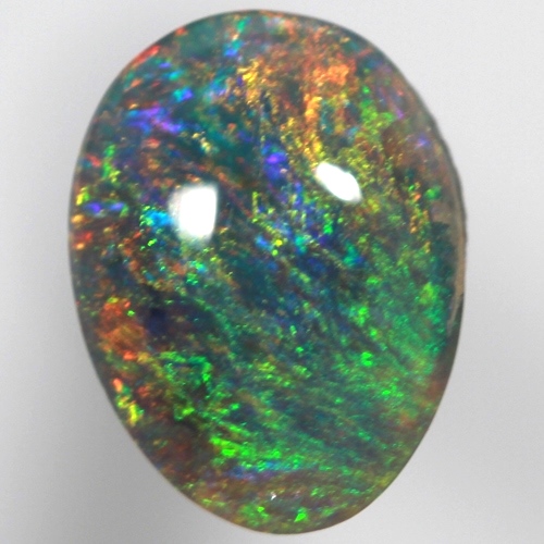 SOLID SEMI BLACK OPAL Pinfire pattern of orange green and blue